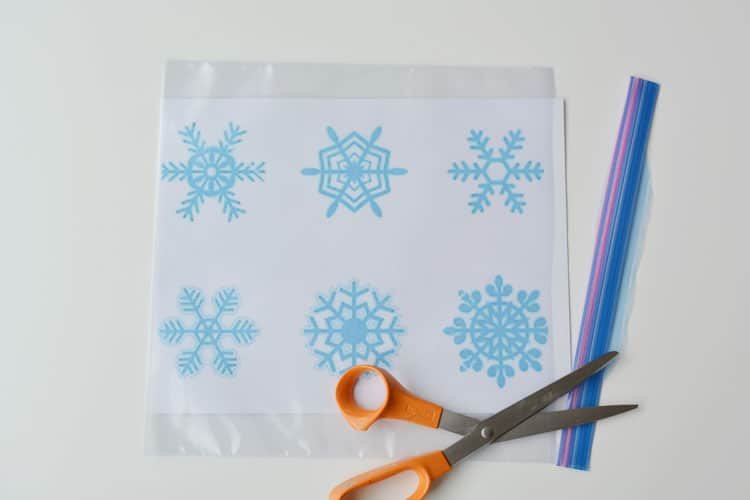 These snowflake window clings are so easy to make and they end up looking SO PRETTY! They're a great decoration that can be left up all winter!