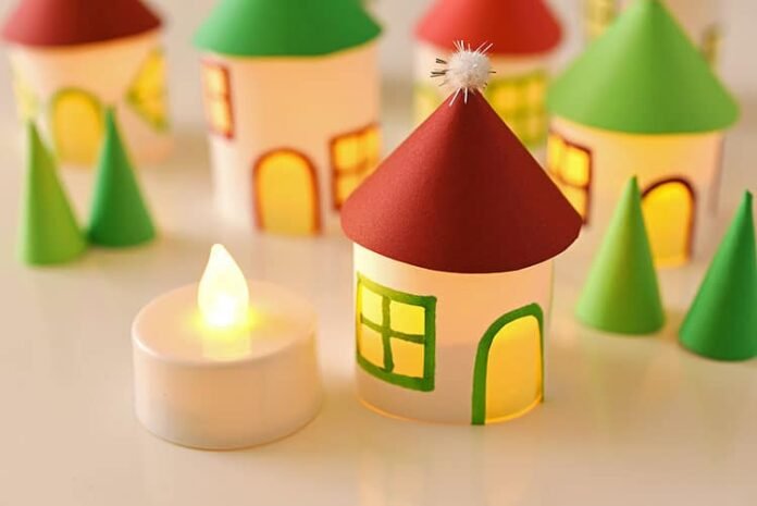 This paper roll Christmas village is SO CUTE and it's really easy to make! Add a few battery operated tea lights and you can create a magical glowing village. This is such a cute Christmas decoration and a super fun Christmas craft to make with the kids.