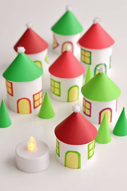 This paper roll Christmas village is SO CUTE and it's really easy to make! Add a few battery operated tea lights and you can create a magical glowing village. This is such a cute Christmas decoration and a super fun Christmas craft to make with the kids.