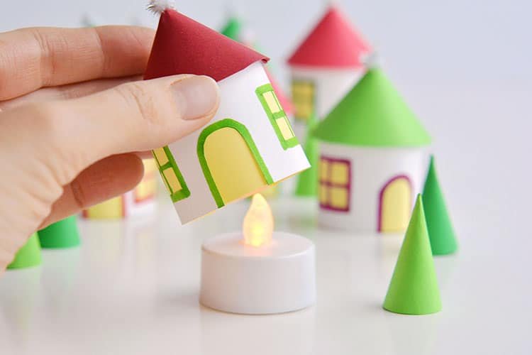 This paper roll Christmas village is SO CUTE and it's really easy to make! Add a few battery operated tea lights and you can create a magical glowing village. This is such a cute Christmas decoration and a super fun Christmas craft to make with the kids.