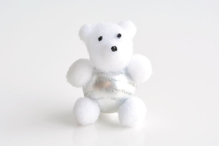 These pom pom teddy bear ornaments are ADORABLE for Christmas and they're super easy to make! All you need are dollar store pom poms and Christmas ball ornaments. This is such a fun dollar store kids craft idea for Christmas and a cute idea for homemade Christmas ornaments! Cutest little teddy bears ever!