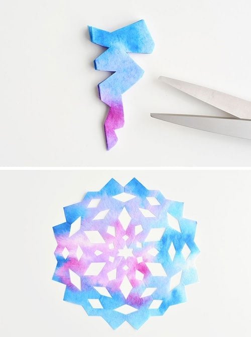 These coffee filter snowflakes are so easy to make and they are SO PRETTY! This is such a fun winter craft idea! A great activity for a snow day at home but also simple enough for teachers to make with the whole class at school. They make beautiful sun catchers and are a great Christmas decoration that can stay up all winter long! 