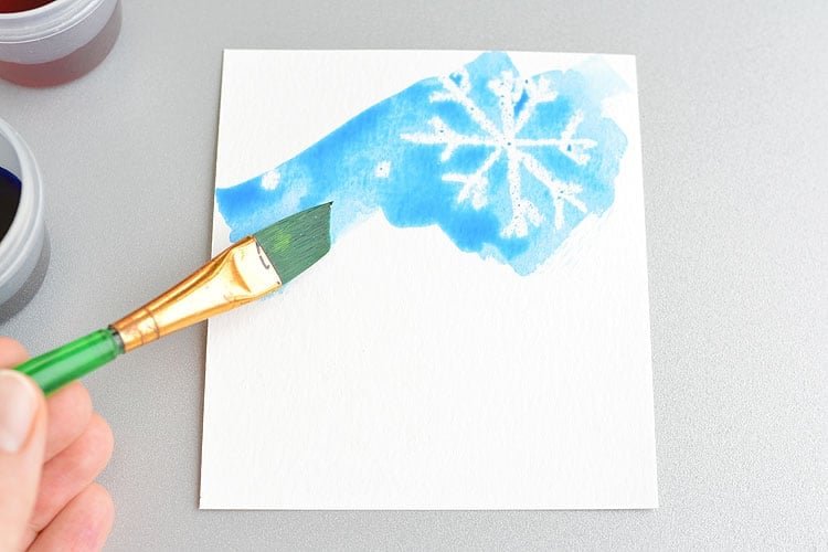 This magic salt and watercolor snowflake art project for kids is so much fun! The snowflakes magically appear when you add the paint and the salt makes the painting look “frosty”. This is such a cool process art idea for kids that’s fantastic in the classroom at school or on a snowy day at home this winter!