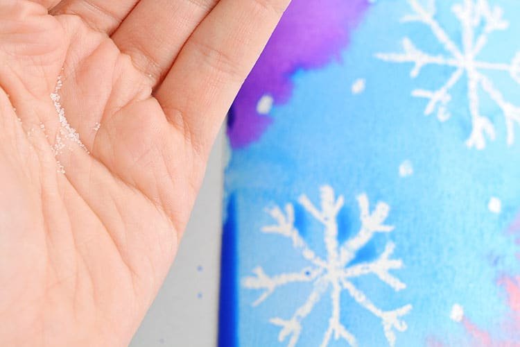 This magic salt and watercolor snowflake art project for kids is so much fun! The snowflakes magically appear when you add the paint and the salt makes the painting look “frosty”. This is such a cool process art idea for kids that’s fantastic in the classroom at school or on a snowy day at home this winter!