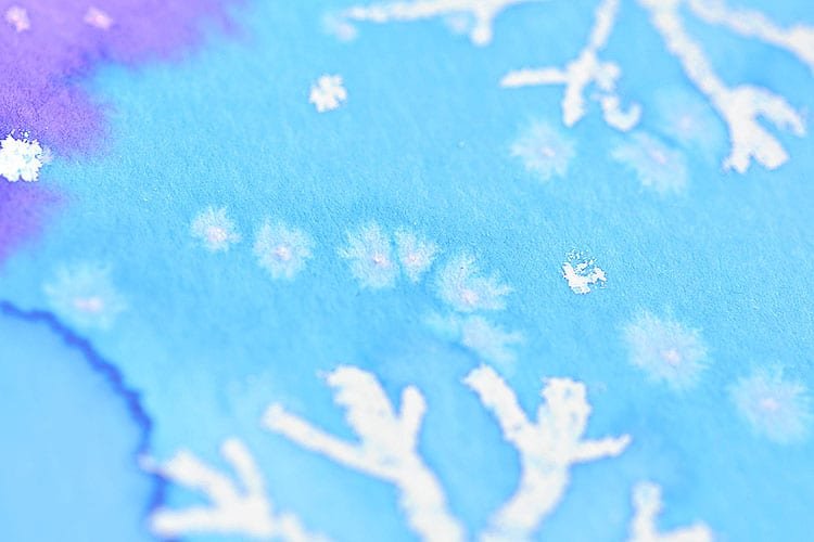 This magic salt and watercolor snowflake art project for kids is so much fun! The snowflakes magically appear when you add the paint and the salt makes the painting look “frosty”. This is such a cool process art idea for kids that’s fantastic in the classroom at school or on a snowy day at home this winter!