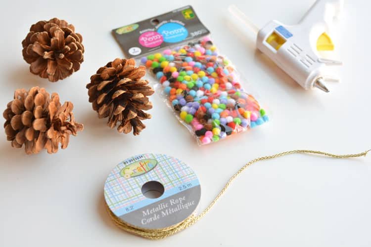 These pom pom and pinecone ornaments are SO EASY! They're a great craft for both kids and adults and they end up looking surprisingly beautiful!