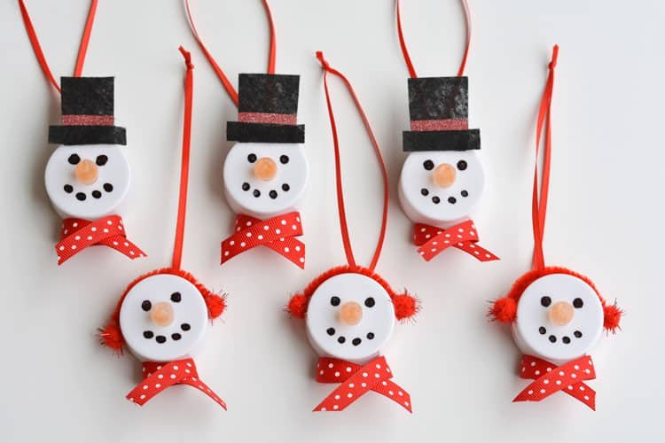 These tea light snowman ornaments are really easy to make and they look ADORABLE! Turn on the tea light and the "flame" becomes the snowman's carrot nose!