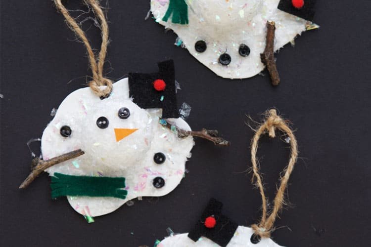 These melted snowman ornaments use faux snow and styrofoam balls to create the cutest snowman craft ever!