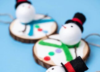 DIY Melting Snowman Ornament Melting snowman ornaments made on a wood slice
