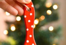 How to make Paint Brush Santa Paint brush Santa ornament held in front of a Christmas tree