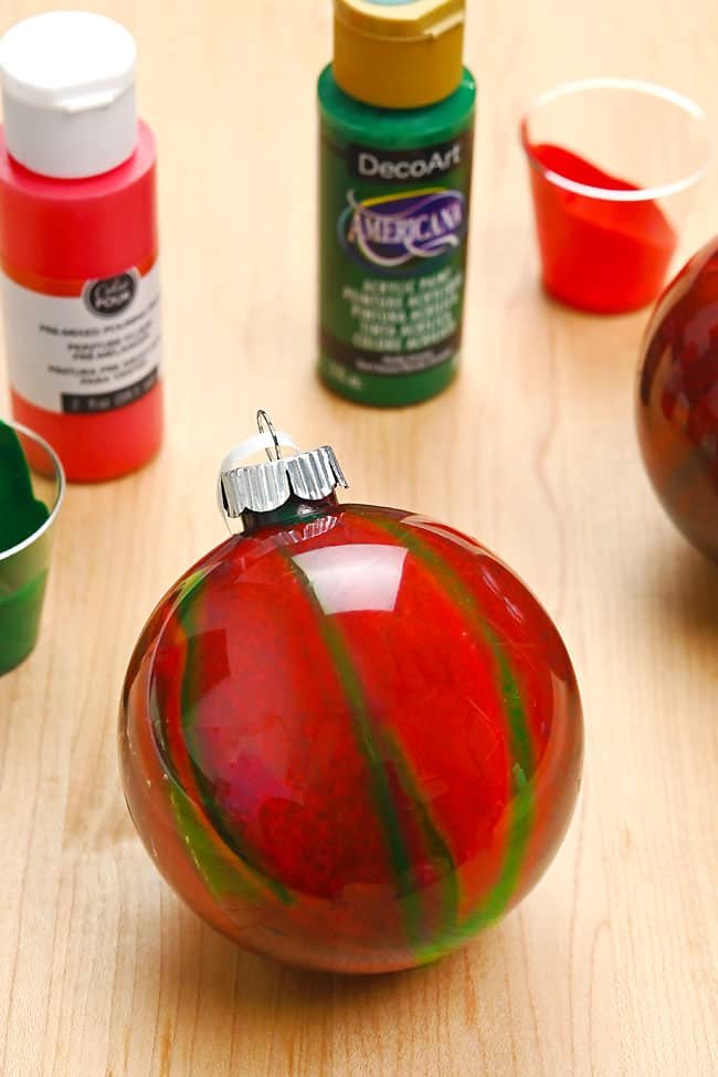 Red and green marbled paint pour Christmas ornament