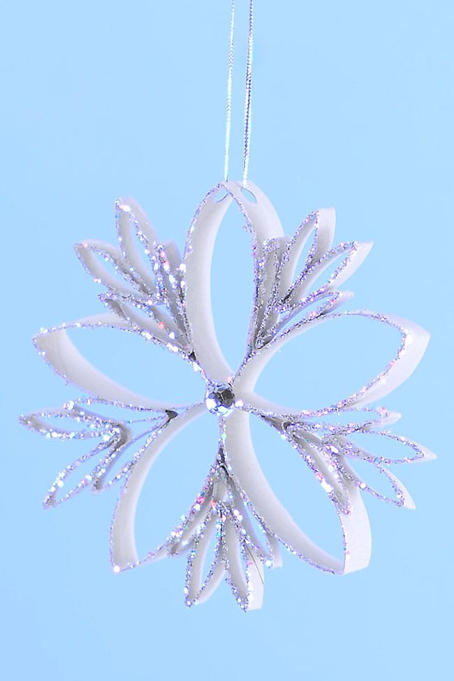 These paper roll snowflakes are SO BEAUTIFUL and really easy to make! This is such a great Christmas craft that you can leave up all winter long. Hang them on the Christmas tree, or in the window as a beautiful winter decoration. This is such a great winter craft idea and a fun way to recycle empty toilet paper rolls!