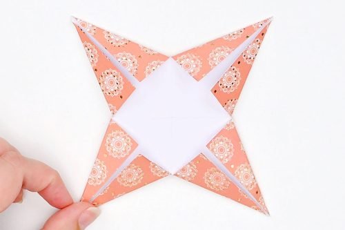 Paper folded to have 4 points like a star