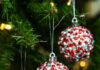 Rhinestone Christmas Ornaments Three rhinestone Christmas ornaments hanging on a Christmas tree