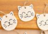 How to make Salt Dough Cat Ornaments Painted salt dough cat ornaments on a wooden surface