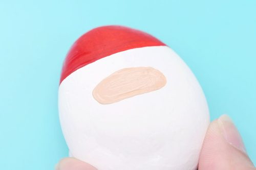 santa-claus-painted-rocks-3-500x333-1 Red, white, and peach painted rock