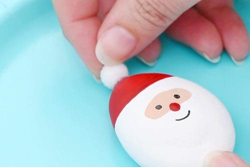 santa-claus-painted-rocks-8-500x334-1 Adding pom pom to Santa rock hat