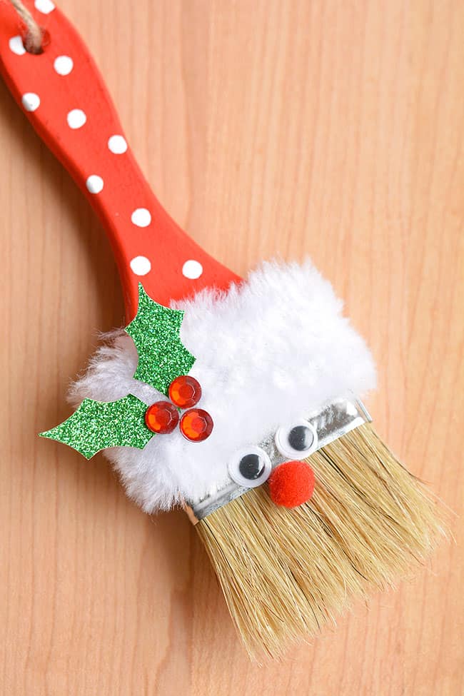 Santa paint brush ornament on a wooden background