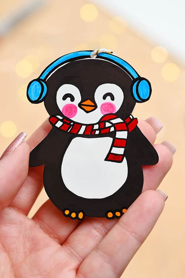 Holding a Shrinky Dinks penguin ornament