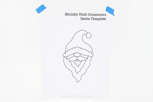 Santa ornament template taped at top corners