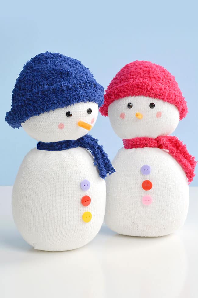 Sock snowmen with hats and scarves