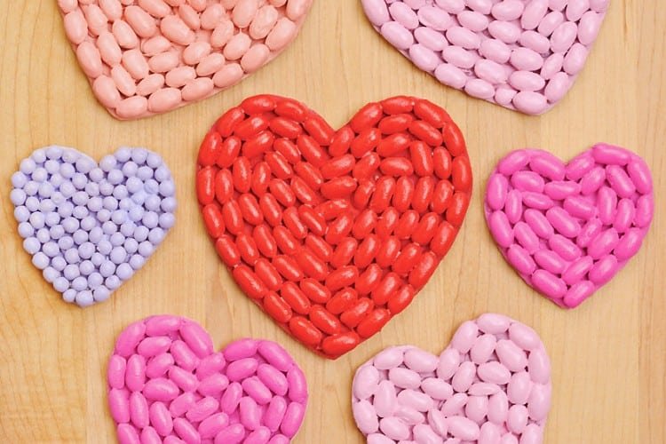 Red, pink, and purple hearts made from dried beans