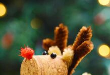 How to Make Wine Cork Reindeer Wine cork reindeer in front of a Christmas tree
