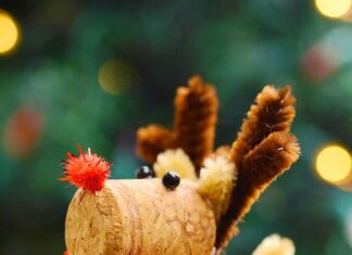 How to Make Wine Cork Reindeer Wine cork reindeer in front of a Christmas tree